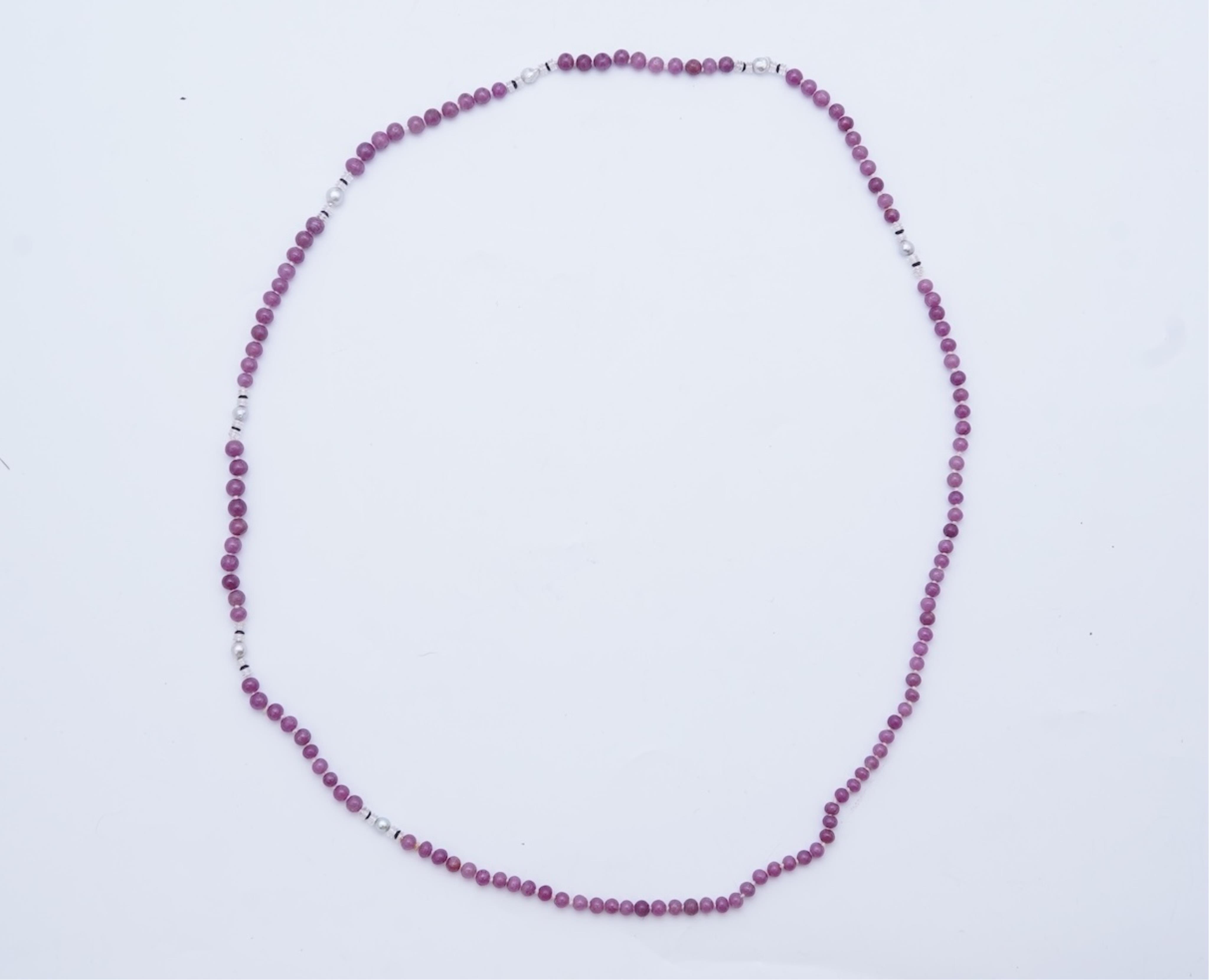 A ruby bead, onyx, rock crystal and pearl necklace